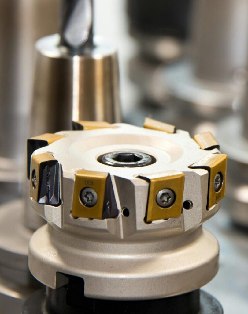 drill milling milling machine drilling 51320 51320 1 Detailed view of various metal drill bits and tools arranged in a workshop setting.