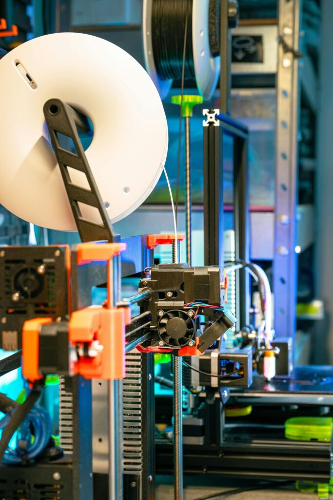pexels photo 24251727 24251727 A state-of-the-art 3D printer in a modern workshop setting, showcasing technology and innovation.