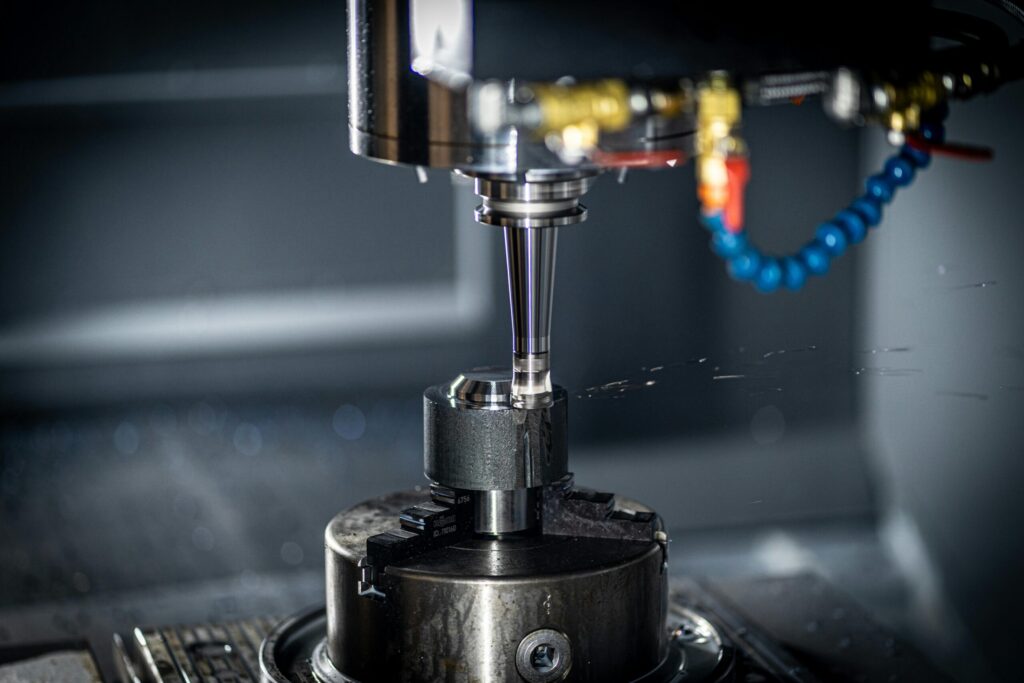 pexels photo 8865187 8865187 Close-up of CNC machine in action, showcasing precision engineering and industrial equipment.
